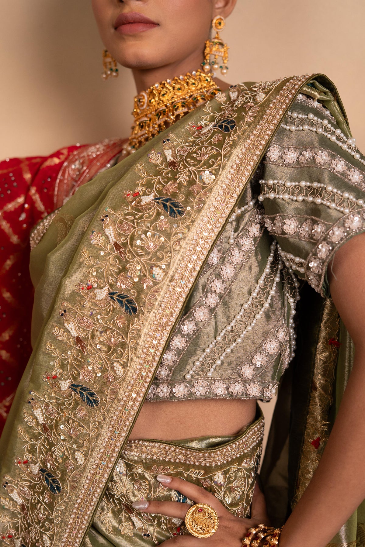 Sage Green Tissue Silk Saree with Zardozi & Bird Motif Border